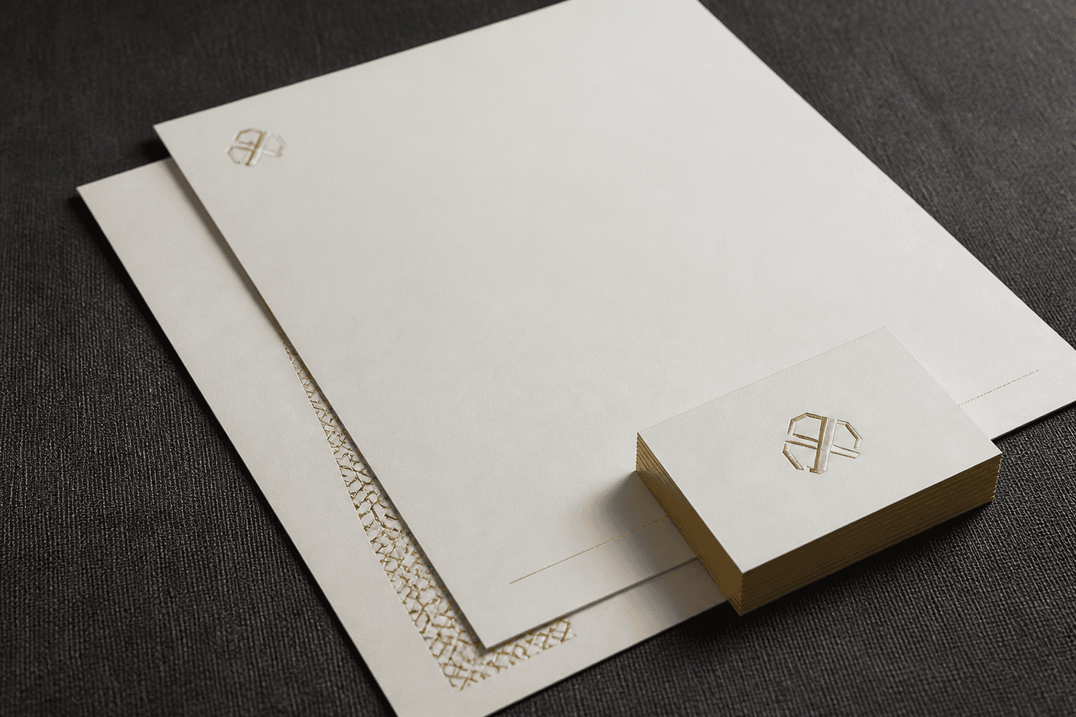 Gold-foil visiting cards and cream letterheads from the studio