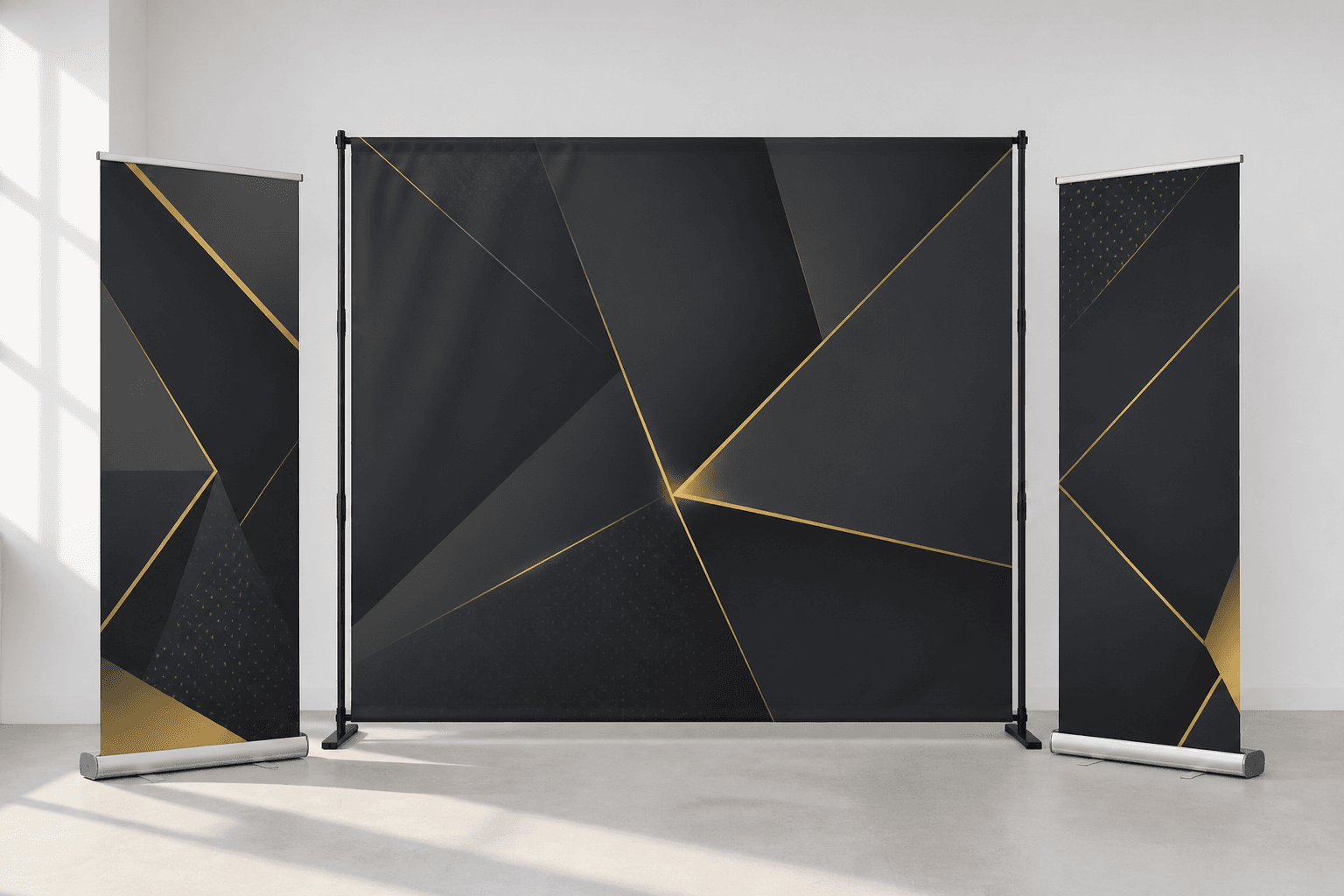 Event standees and a charcoal-and-gold backdrop in the studio